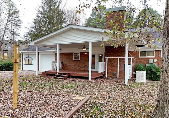 view of front of house with a garage and ceiling fan