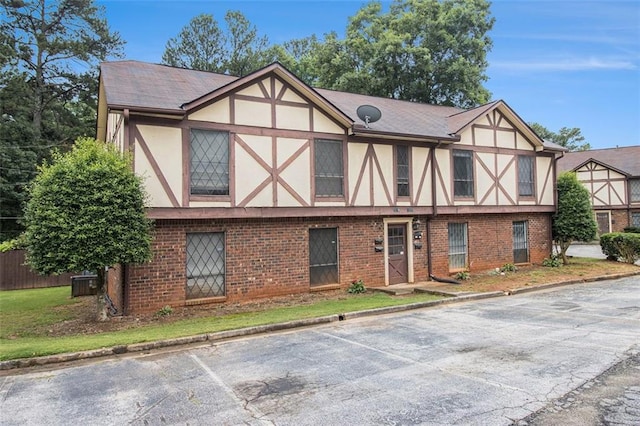 3232 Abbeywood Dr, Decatur, GA 30034 - tudor home with stucco siding, brick siding, and uncovered parking