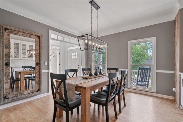 4030 Scenic View Ct, Cumming, GA 30028 - dining room with ornamental molding, light wood finished floors, an inviting chandelier, and baseboards