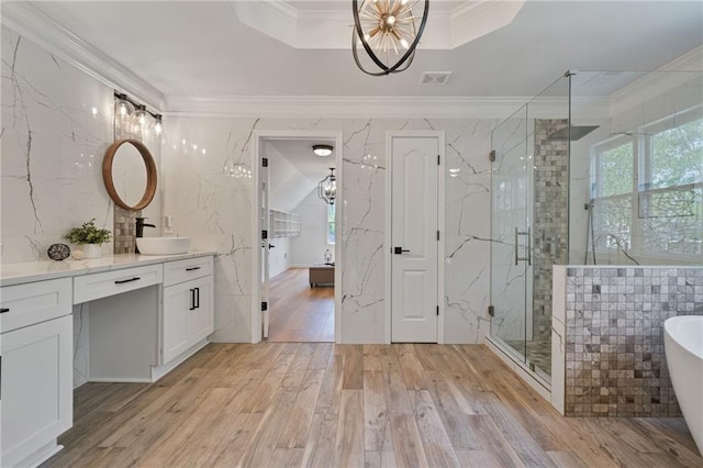 4030 Scenic View Ct, Cumming, GA 30028 - full bath with a freestanding tub, wood finished floors, a shower stall, and ornamental molding