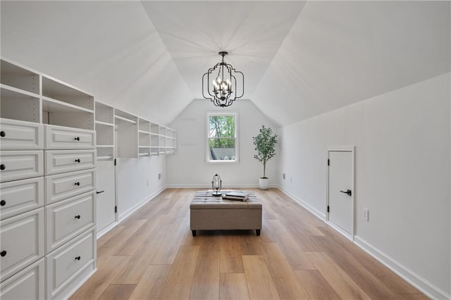 4030 Scenic View Ct, Cumming, GA 30028 - interior space with a notable chandelier, baseboards, vaulted ceiling, and light wood-style floors
