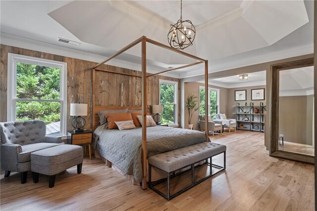 4030 Scenic View Ct, Cumming, GA 30028 - bedroom with crown molding, a notable chandelier, visible vents, and light wood-style floors