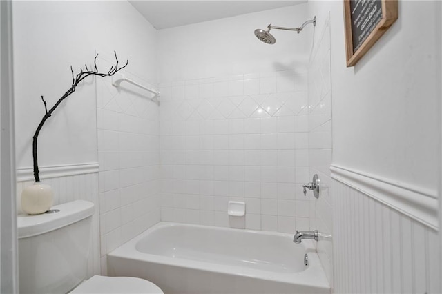 4030 Scenic View Ct, Cumming, GA 30028 - bathroom with toilet, a wainscoted wall, and washtub / shower combination