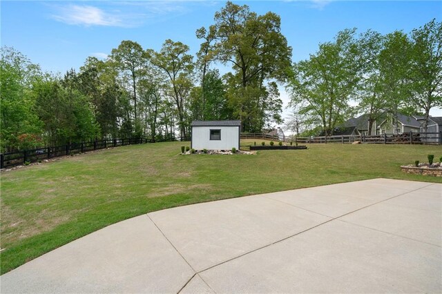 4030 Scenic View Ct, Cumming, GA 30028 - view of yard featuring a patio area, an outbuilding, a shed, and a fenced backyard