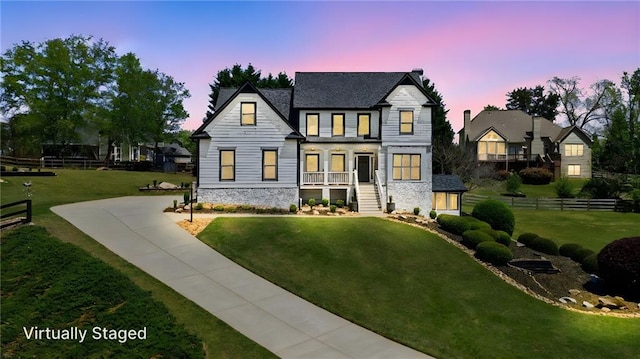 4030 Scenic View Ct, Cumming, GA 30028 - view of front of house with a lawn, stone siding, and fence
