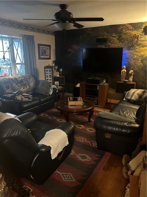 living room featuring ceiling fan and hardwood / wood-style floors