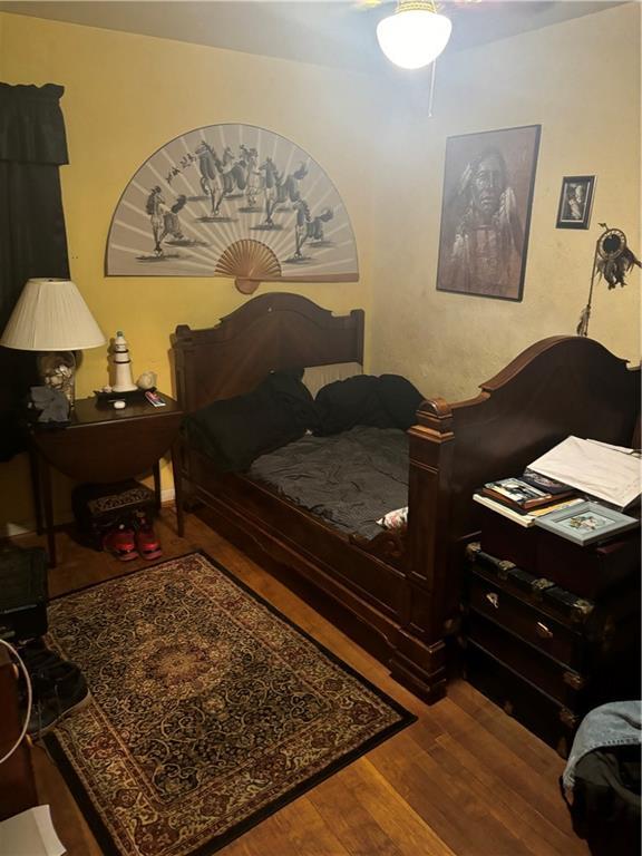 bedroom with wood-type flooring