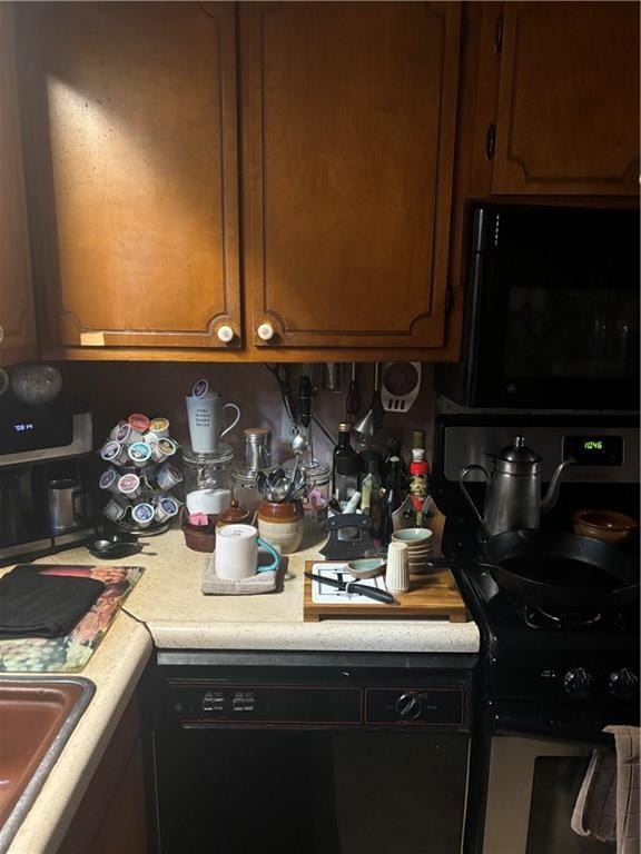 kitchen featuring dishwashing machine and sink