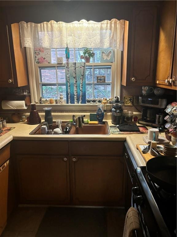 kitchen with sink and black range with electric cooktop