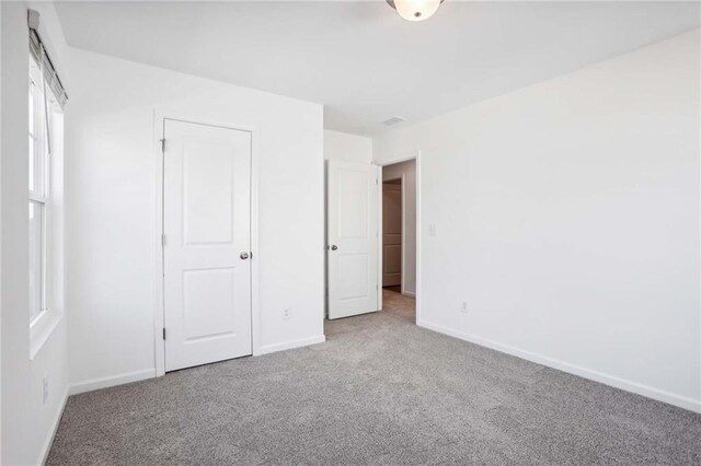 unfurnished bedroom featuring carpet floors