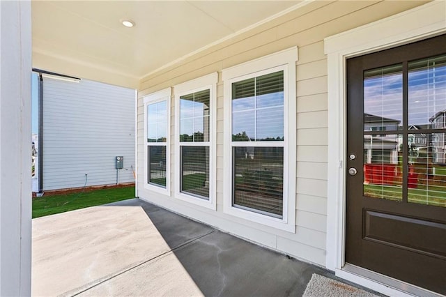 property entrance with a patio