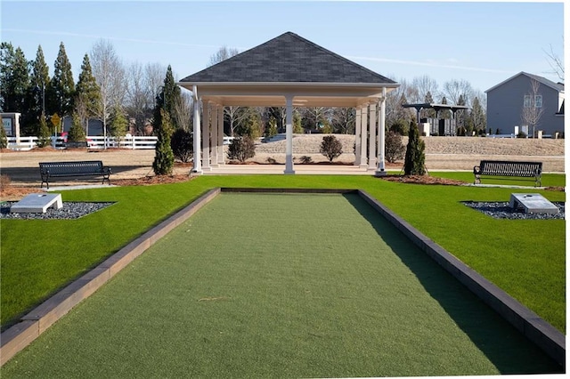 surrounding community featuring a gazebo and a lawn