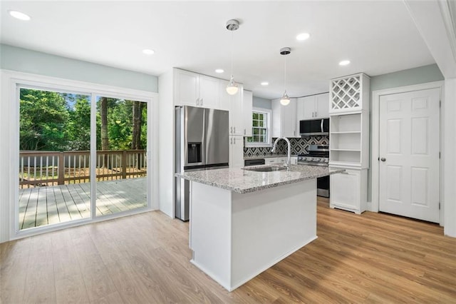 3050 Woodland Dr NW, Kennesaw, GA 30152 - kitchen with a sink, appliances with stainless steel finishes, light wood finished floors, tasteful backsplash, and recessed lighting