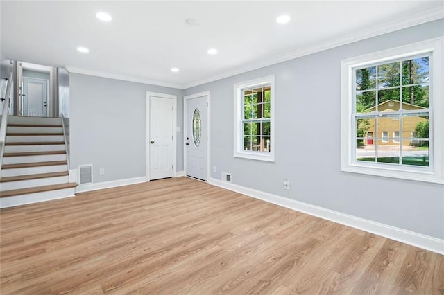 3050 Woodland Dr NW, Kennesaw, GA 30152 - entrance foyer with light wood finished floors, plenty of natural light, crown molding, recessed lighting, and baseboards