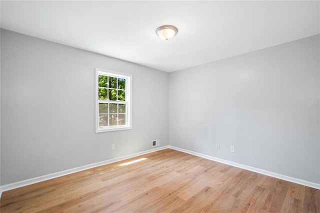 3050 Woodland Dr NW, Kennesaw, GA 30152 - empty room with light wood-style flooring and baseboards