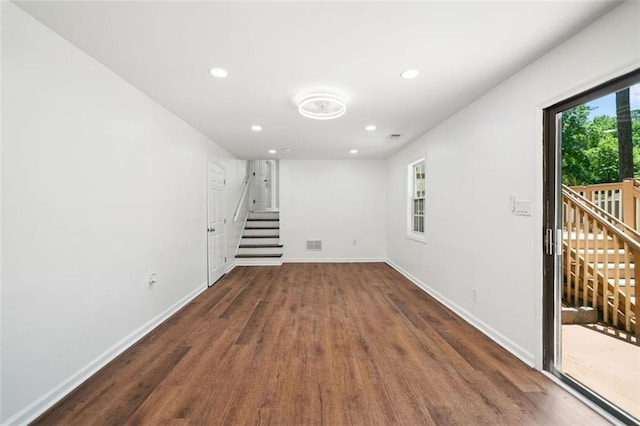 3050 Woodland Dr NW, Kennesaw, GA 30152 - unfurnished room with wood finished floors, baseboards, recessed lighting, and stairs