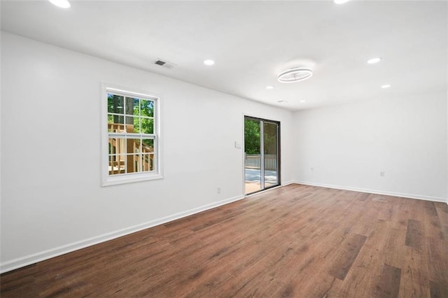 3050 Woodland Dr NW, Kennesaw, GA 30152 - unfurnished room with wood finished floors, baseboards, and recessed lighting