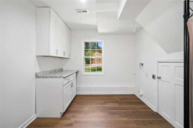 3050 Woodland Dr NW, Kennesaw, GA 30152 - laundry area with hookup for a washing machine, electric dryer hookup, dark wood-style flooring, cabinet space, and baseboards