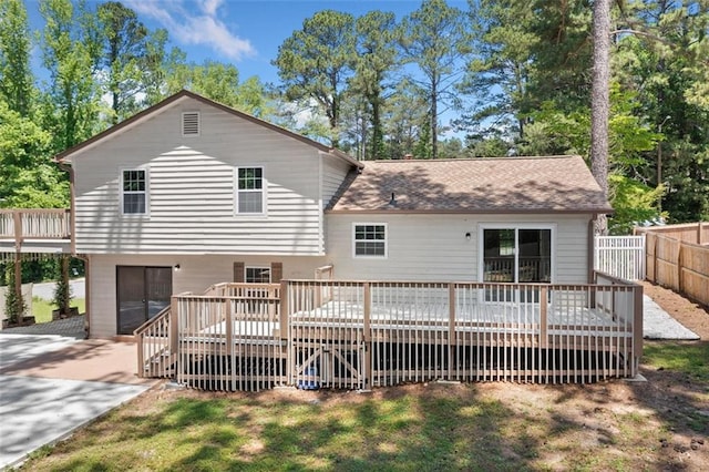 3050 Woodland Dr NW, Kennesaw, GA 30152 - rear view of house with a deck, a patio area, and a shingled roof