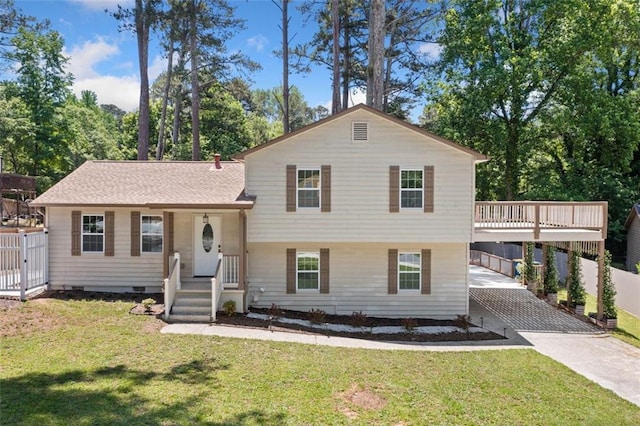 3050 Woodland Dr NW, Kennesaw, GA 30152 - tri-level home with concrete driveway, a front lawn, and a carport