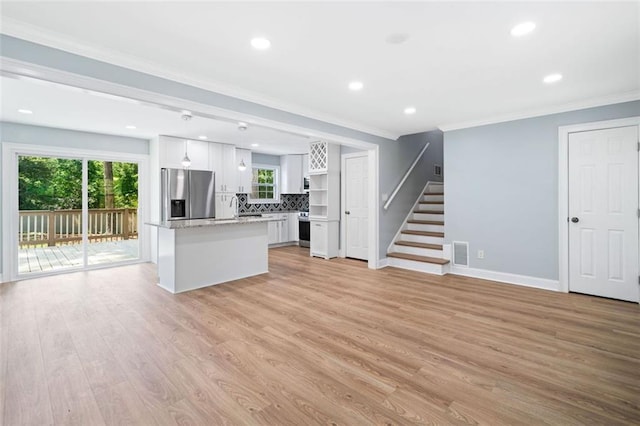 3050 Woodland Dr NW, Kennesaw, GA 30152 - kitchen featuring stainless steel fridge with ice dispenser, ornamental molding, white cabinetry, recessed lighting, and light wood-type flooring