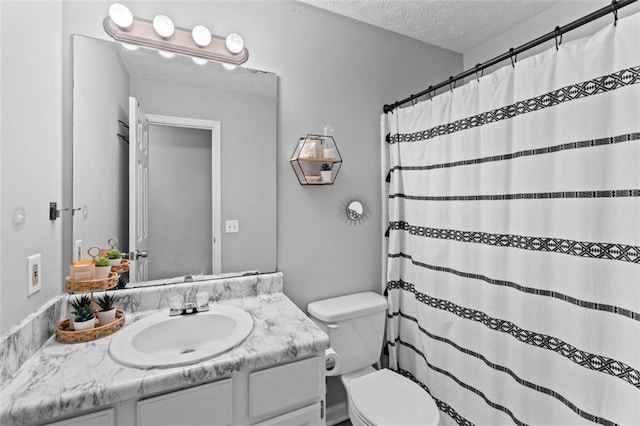 full bathroom featuring curtained shower, a textured ceiling, vanity, and toilet