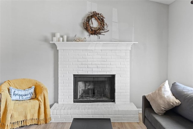 room details with a fireplace and wood finished floors