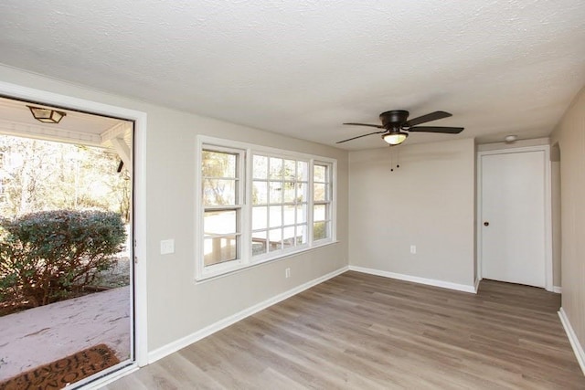 272 Old Sudie Rd, Hiram, GA 30141 - interior space featuring wood finished floors, ceiling fan, a textured ceiling, and baseboards
