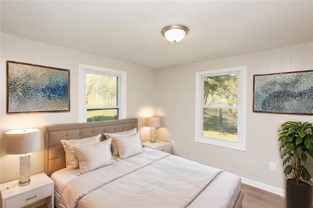 272 Old Sudie Rd, Hiram, GA 30141 - bedroom featuring wood finished floors, baseboards, and a decorative wall