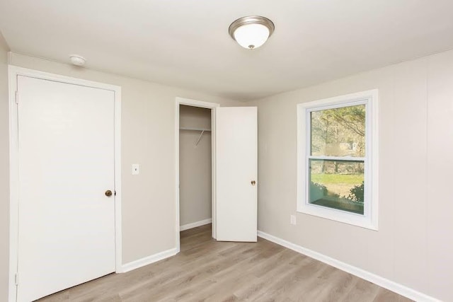 272 Old Sudie Rd, Hiram, GA 30141 - unfurnished bedroom featuring light wood-style floors, baseboards, and a closet