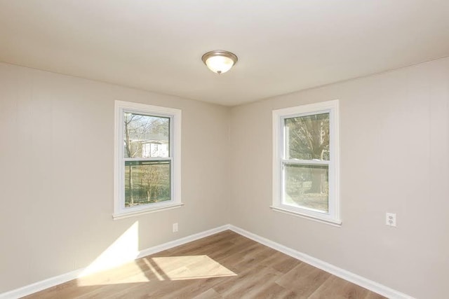 272 Old Sudie Rd, Hiram, GA 30141 - empty room with healthy amount of natural light, wood finished floors, and baseboards