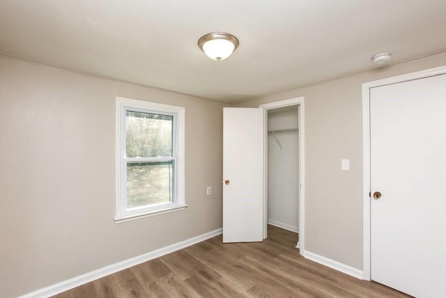 272 Old Sudie Rd, Hiram, GA 30141 - unfurnished bedroom with wood finished floors and baseboards