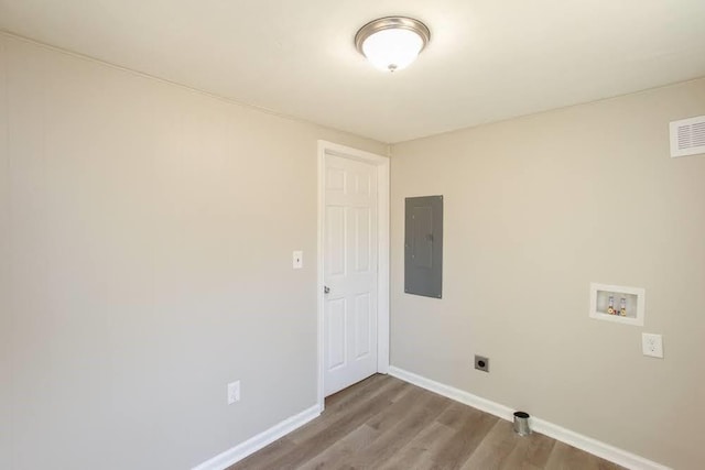 272 Old Sudie Rd, Hiram, GA 30141 - washroom with electric panel, hookup for a washing machine, baseboards, wood finished floors, and hookup for an electric dryer