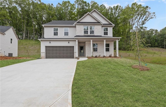 view of front facade with covered porch, driveway, a front yard, cooling unit, and an attached garage
