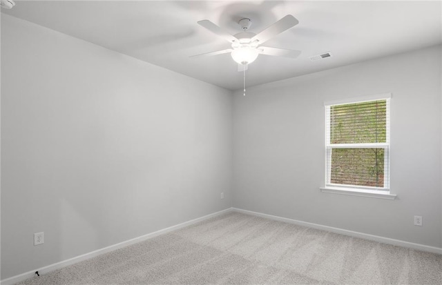 404 Beacon Way, Villa Rica, GA 30180 - empty room featuring light carpet, baseboards, and a ceiling fan