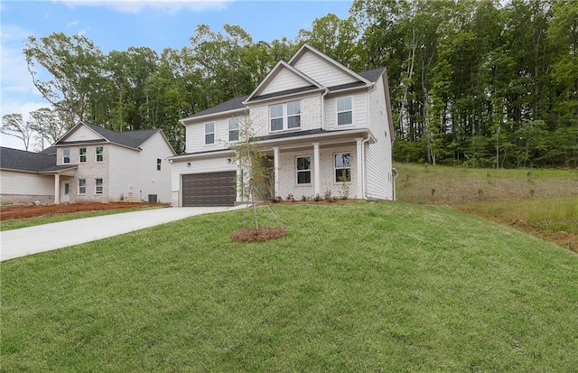 view of front facade featuring an attached garage, a front lawn, and driveway