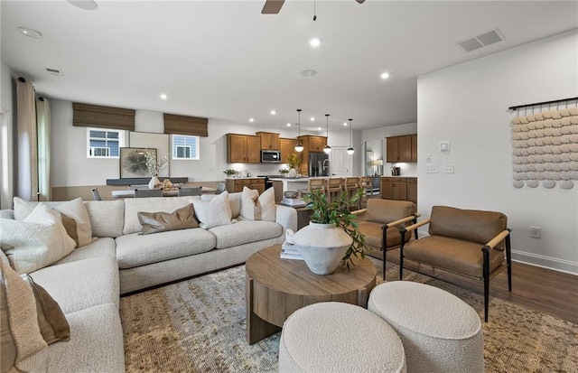 living area featuring ceiling fan, recessed lighting, baseboards, wood finished floors, and visible vents