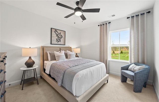 bedroom with light colored carpet, baseboards, and visible vents