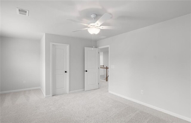 unfurnished bedroom with baseboards, carpet flooring, and visible vents