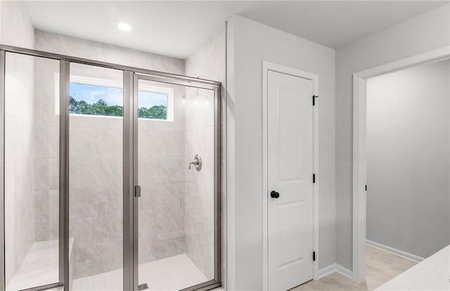 full bath featuring baseboards and a stall shower