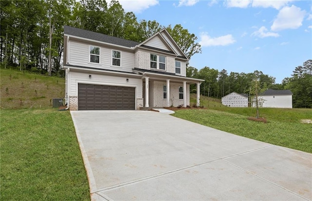 404 Beacon Way, Villa Rica, GA 30180 - view of front of home with a garage, driveway, covered porch, and a front lawn