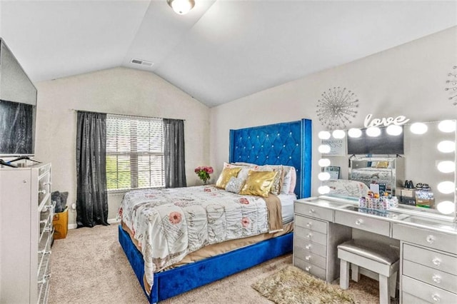 carpeted bedroom with visible vents and lofted ceiling