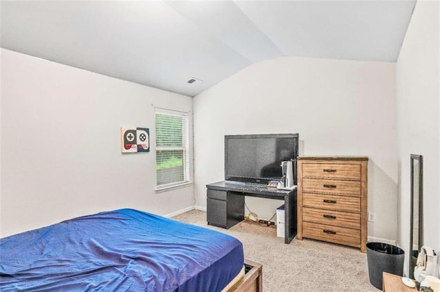 bedroom featuring baseboards, visible vents, lofted ceiling, and light carpet