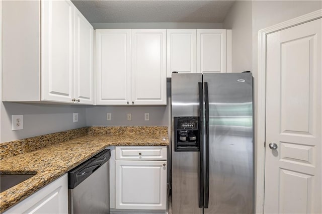 10 NE Perimeter Summit Blvd Unit 3107, Atlanta, GA 30319 - kitchen featuring appliances with stainless steel finishes, white cabinetry, and light stone counters