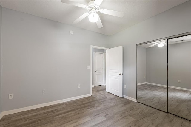 10 NE Perimeter Summit Blvd Unit 3107, Atlanta, GA 30319 - unfurnished bedroom with wood finished floors, a closet, and ceiling fan
