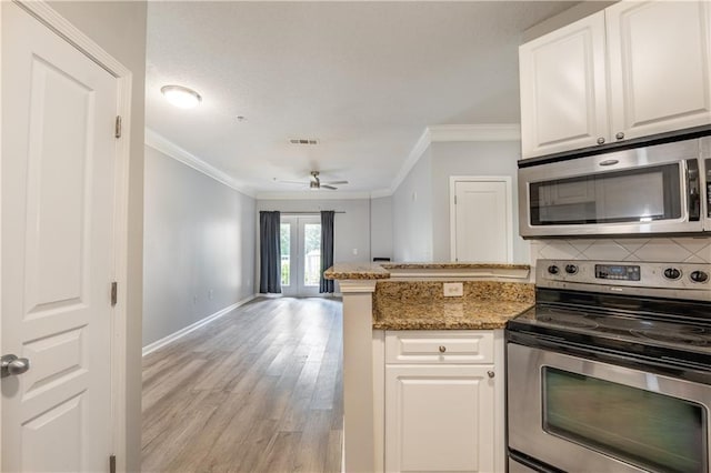 10 NE Perimeter Summit Blvd Unit 3107, Atlanta, GA 30319 - kitchen featuring stainless steel appliances, crown molding, decorative backsplash, white cabinets, and light wood-style floors