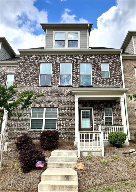 3658 Hidden Valley Cir, Lawrenceville, GA 30044 - view of property featuring brick siding and covered porch