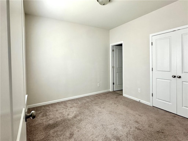 3658 Hidden Valley Cir, Lawrenceville, GA 30044 - unfurnished bedroom featuring baseboards, carpet, and a closet