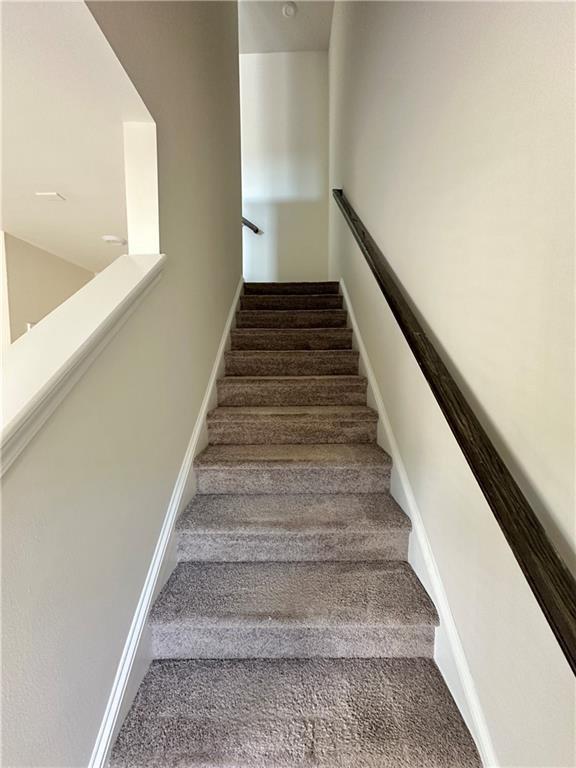 3658 Hidden Valley Cir, Lawrenceville, GA 30044 - staircase with carpet floors and baseboards