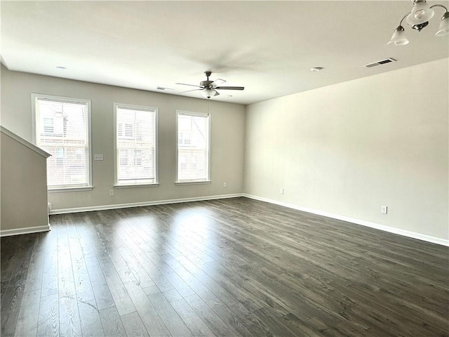 3658 Hidden Valley Cir, Lawrenceville, GA 30044 - unfurnished living room with visible vents, baseboards, dark wood-type flooring, and ceiling fan